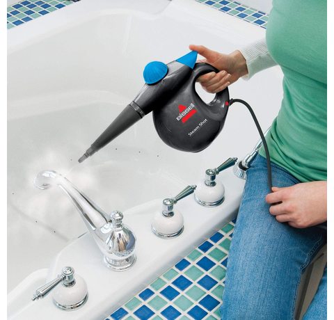 Bissell Handheld Steam Cleaner in use.