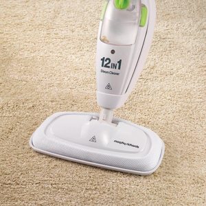Morphy Richards 12-in-1 Steam Cleaner in use on a carpet.
