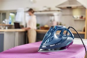 Philips Azur Advanced Steam Iron on an ironing board.