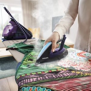 Philips PerfectCare Elite Silence Steam Generator Iron in use.