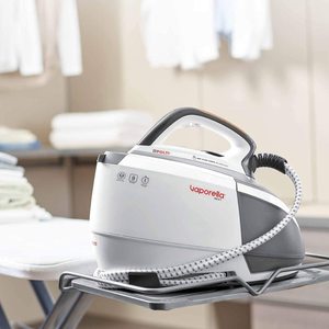 Polti Vaporella Next Steam Generator Iron on an ironing board.