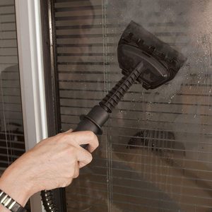 Quest Handheld Steam Cleaner in use.