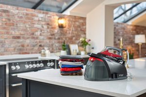 Russell Hobbs Quiet Super Steam Pro Iron next to washing.