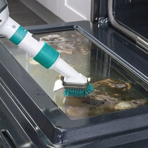 Vax Switch Steam Cleaner in use as a hand-held tool.
