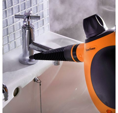 Cleaning a tap with the Vonhaus Handheld Steam Cleaner.